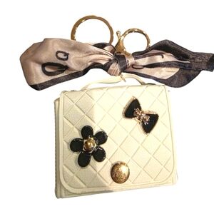 Chic Cream Quilted Handbag with Black Accents